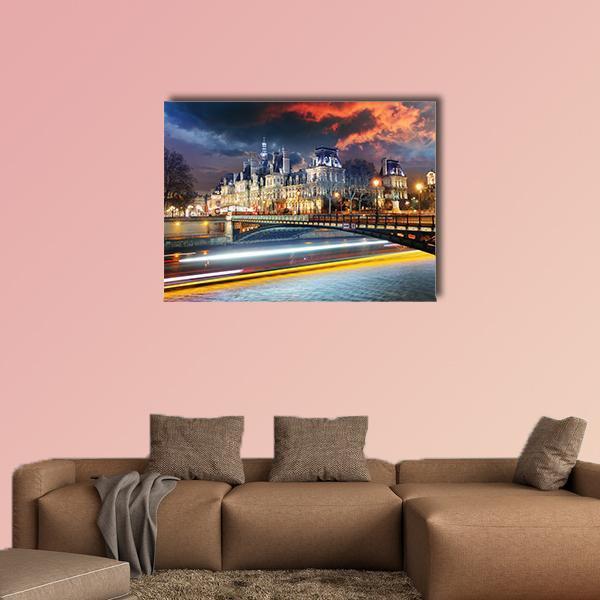 Paris City Hall at Night Canvas Wall Art in orange, yellow and blue, single panel hung on a wall