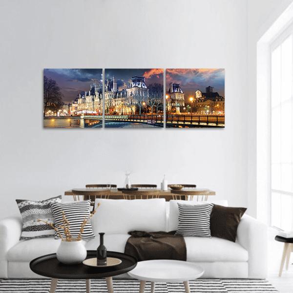 Hotel De Ville Paris at Dusk Panoramic Canvas Wall Art in orange, yellow and blue, single panel hung on a wall