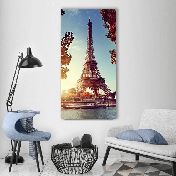 Eiffel Tower in Autumn Vertical Canvas Wall Art in brown, orange and blue, single vertical panel hung on a wall