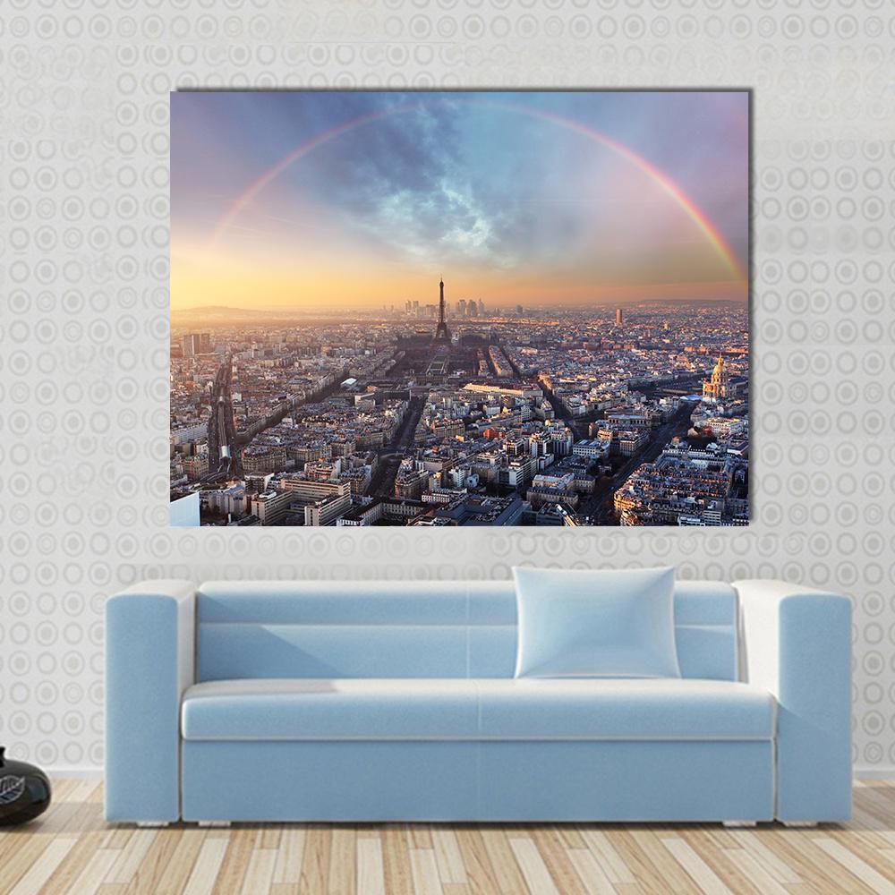 Paris with Rainbow Skyline Canvas Wall Art in gray, yellow and blue, 3 panel horizontal set hung on a wall