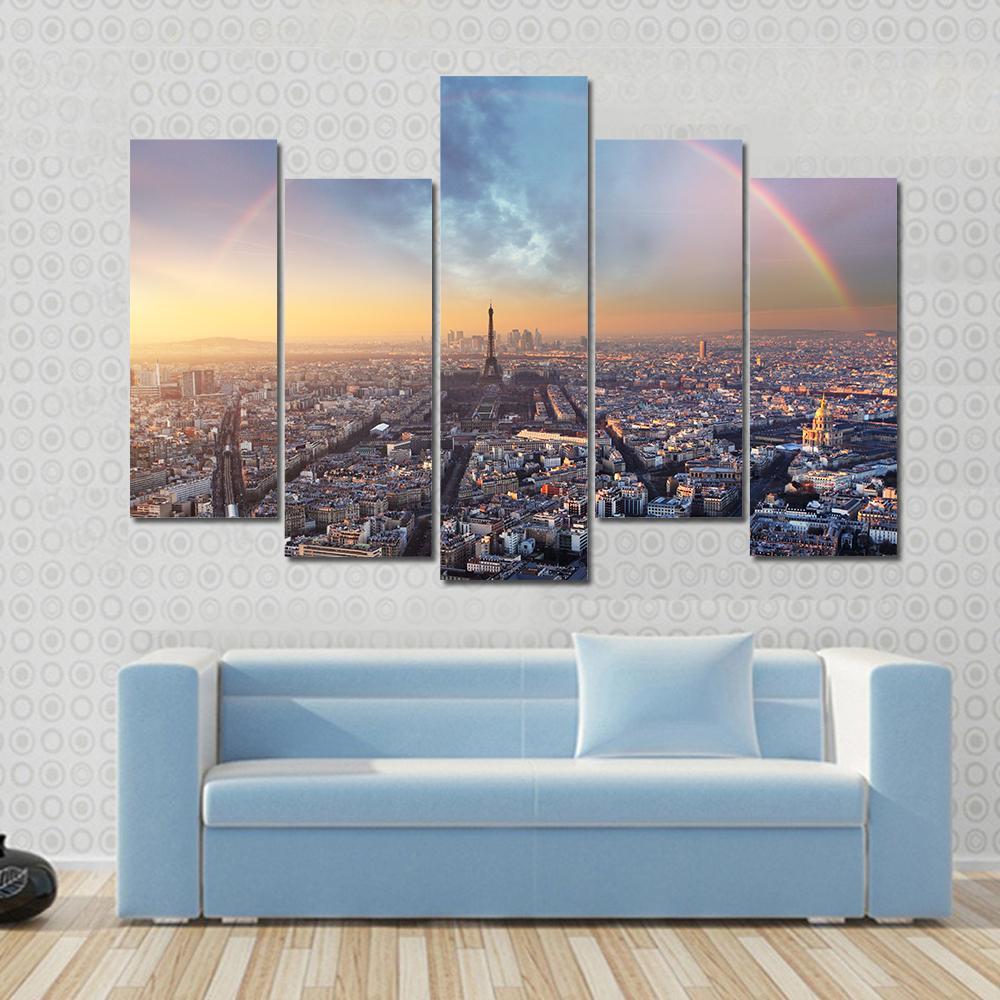 Paris with Rainbow Skyline Canvas Wall Art in gray, yellow and blue, 3 panel horizontal set hung on a wall