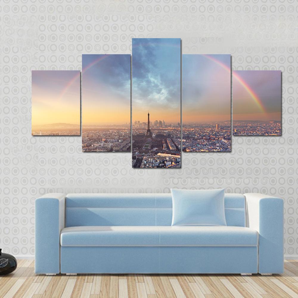 Paris with Rainbow Skyline Canvas Wall Art in gray, yellow and blue, 3 panel horizontal set hung on a wall