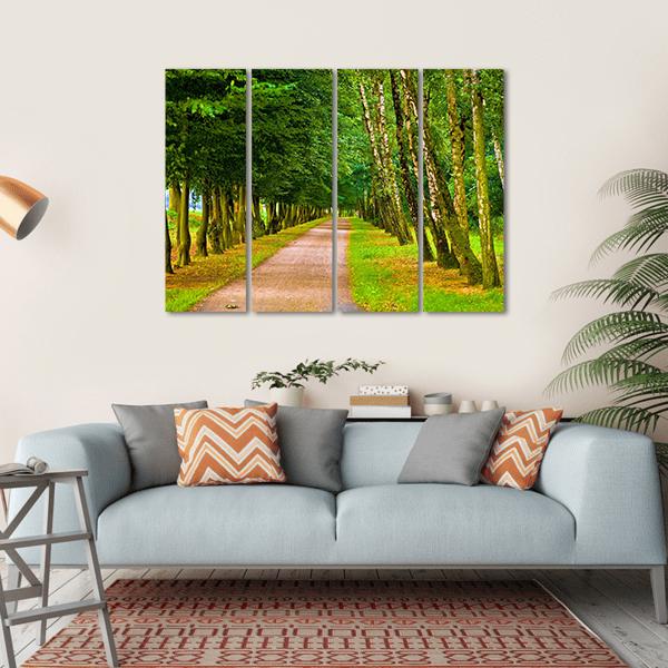 Spring Park Tree-lined Path Canvas Wall Art in brown, yellow and green, hung on a wall