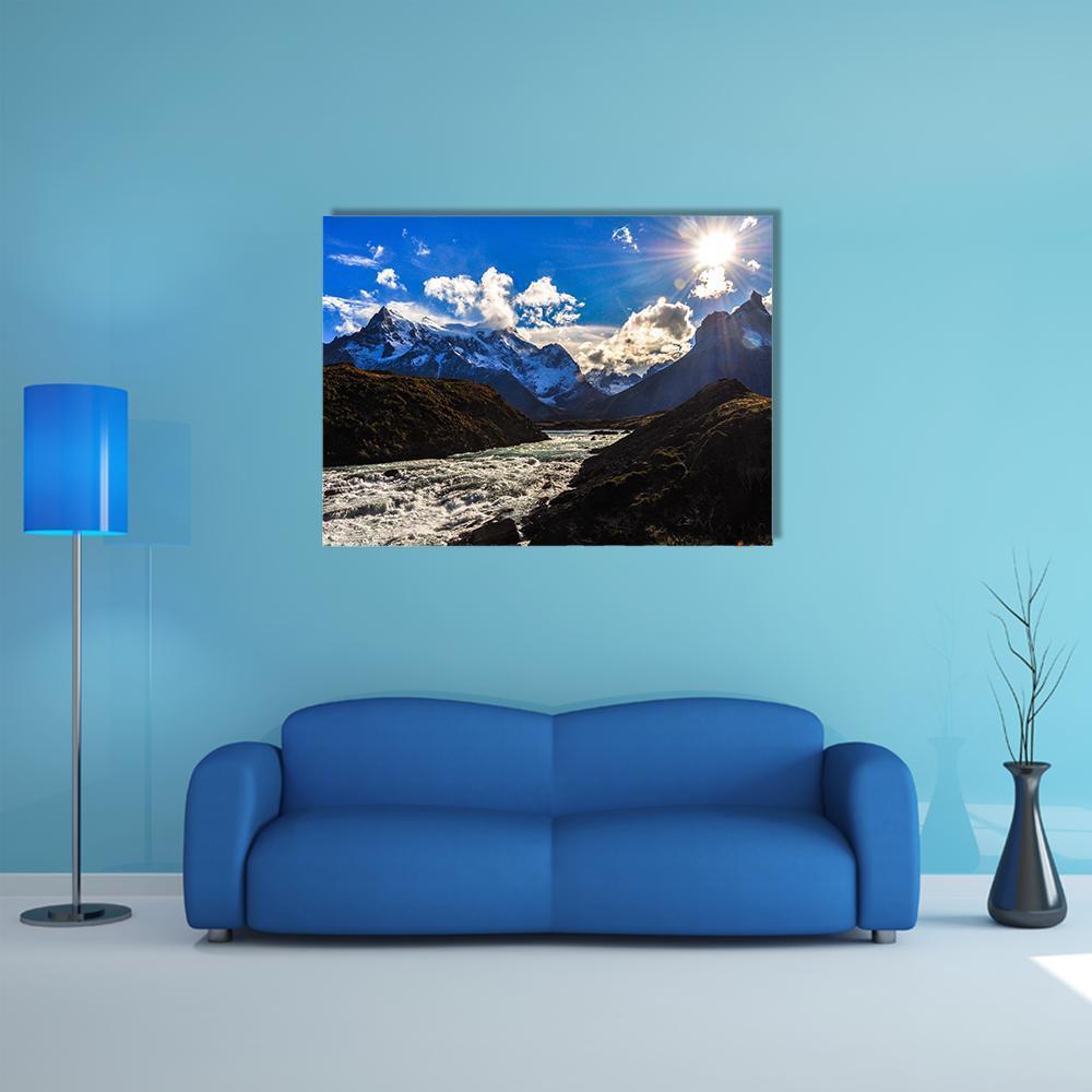 Torres Del Paine Mountain River Scene Canvas Wall Art in white, brown and blue, single panel hung on a wall