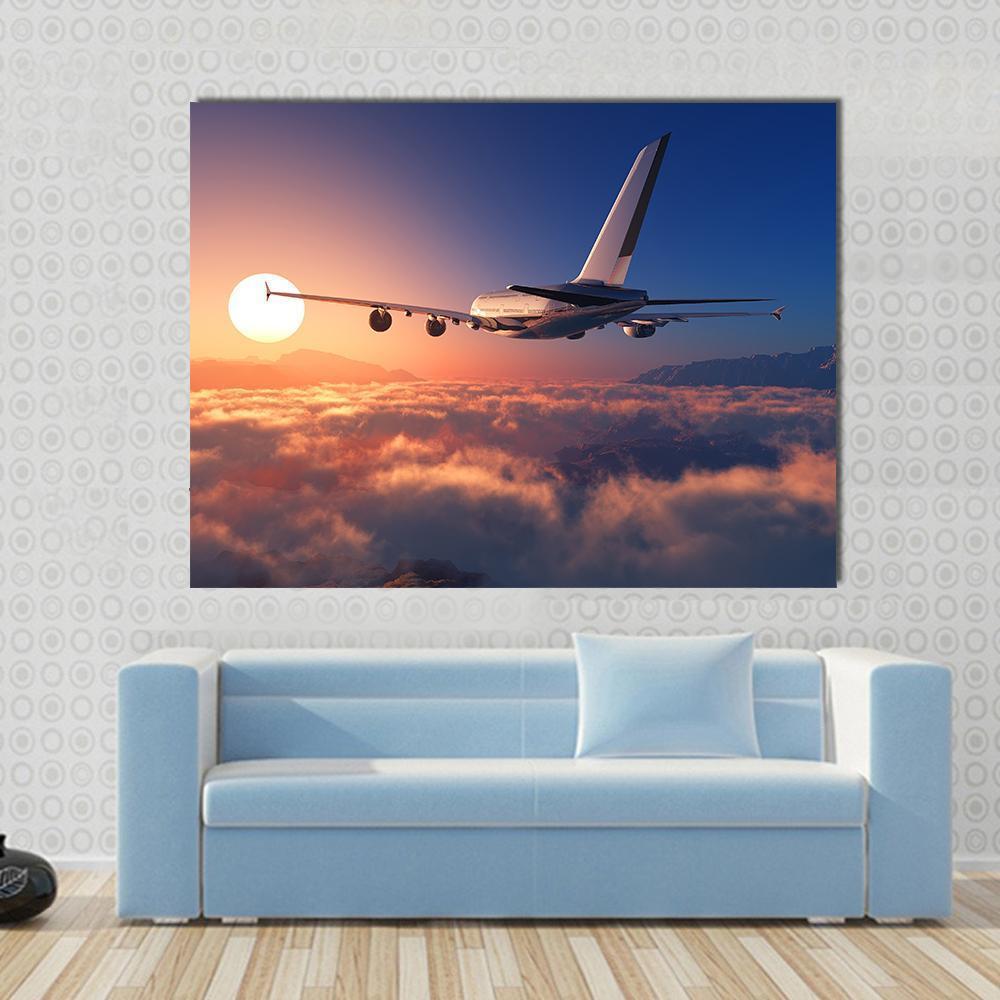 Passenger Plane Above the Clouds Canvas Wall Art in white, orange and blue, single panel hung on a wall