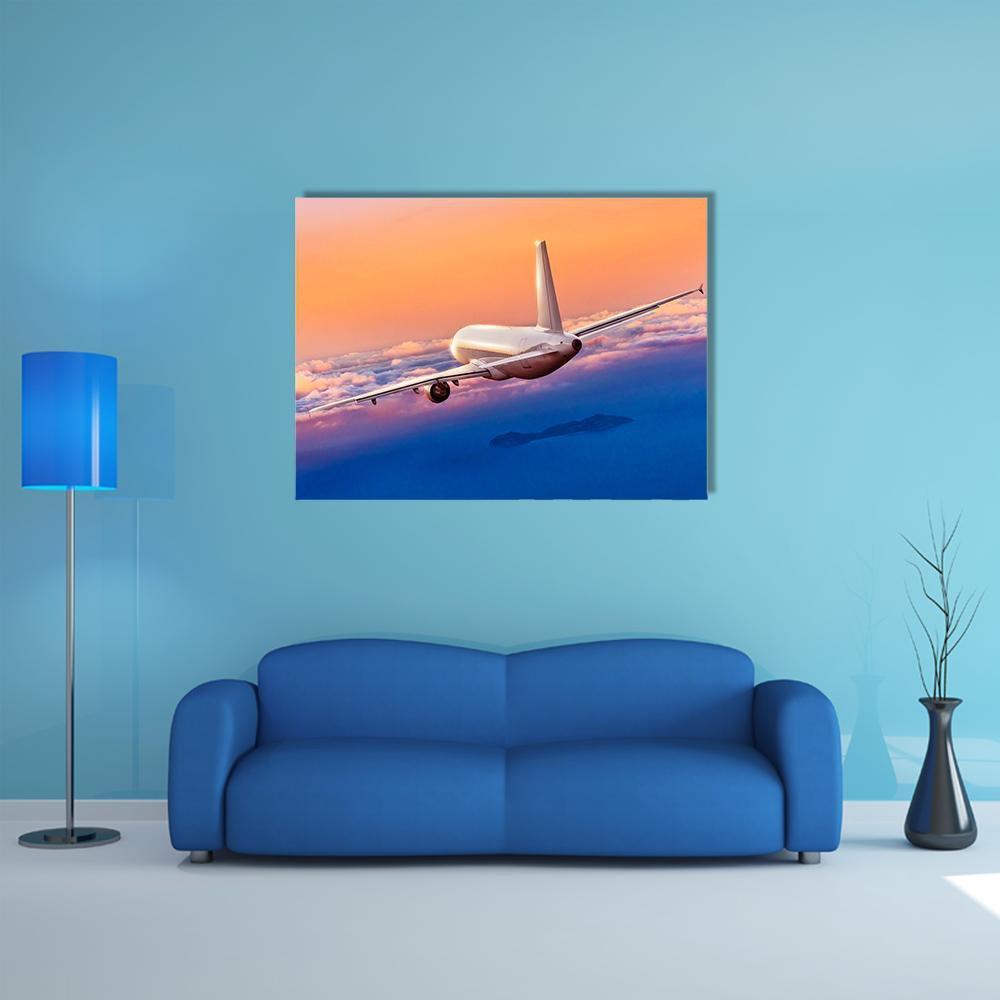 Passenger Airplane at Golden Hour Canvas Wall Art in orange, blue and pink, single panel hung on a wall