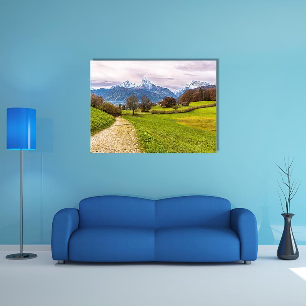 Dirt Path Toward Snow-capped Mountain Canvas Wall Art in white, green and blue, single panel hung on a wall
