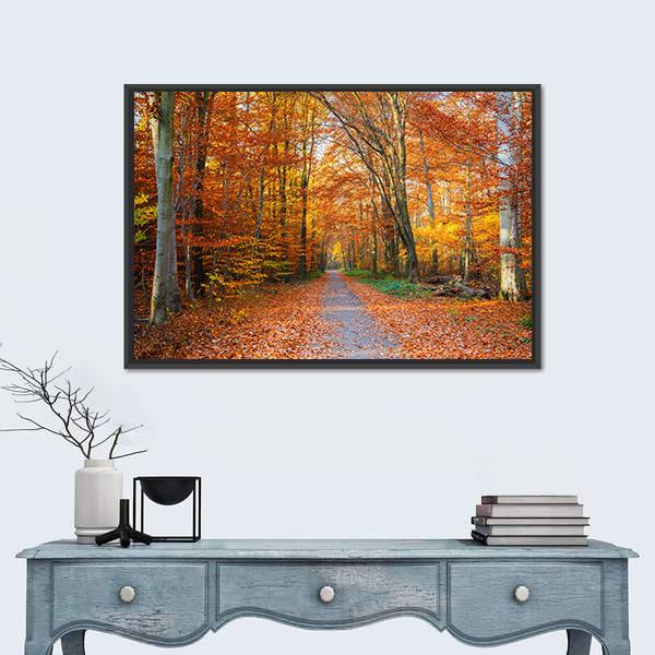 Pathway Through the Autumn Forest Canvas Wall Art in brown, orange and yellow, framed canvas, product view on a white background