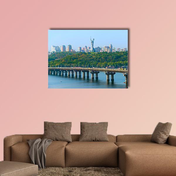 Paton Bridge Over the Dnieper Canvas Wall Art in white, green and blue, single panel hung on a wall