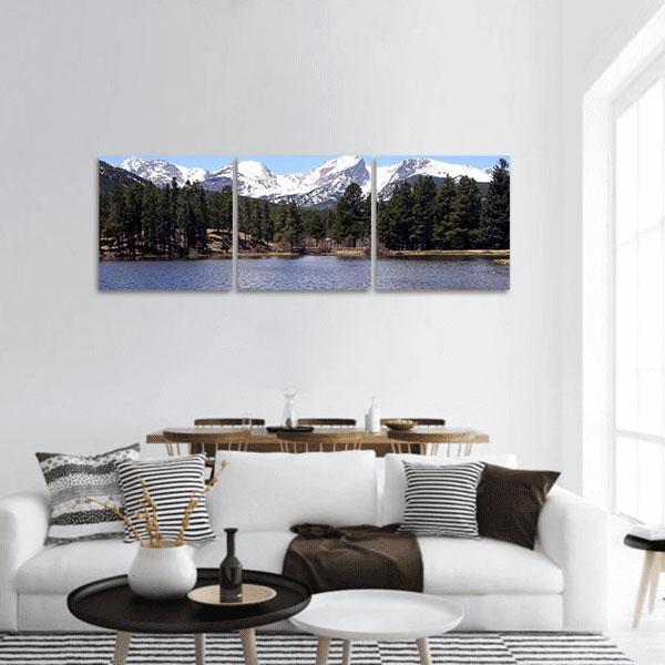 Peaceful Colorado Mountain Lake Panoramic Canvas Wall Art in white, green and blue, hung on a wall