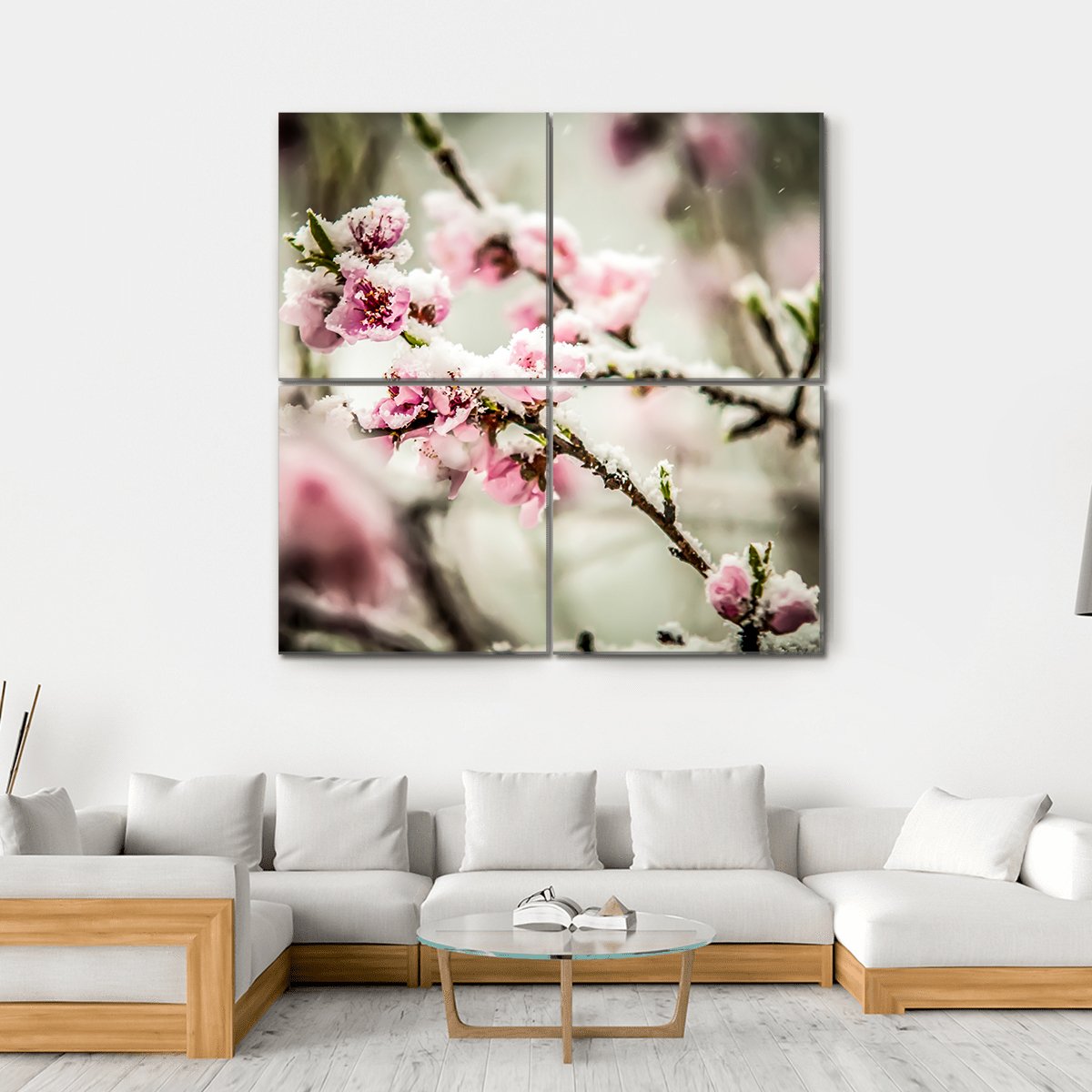 Snow-dusted Peach Blossoms Canvas Wall Art in white, gray and pink, hung on a wall