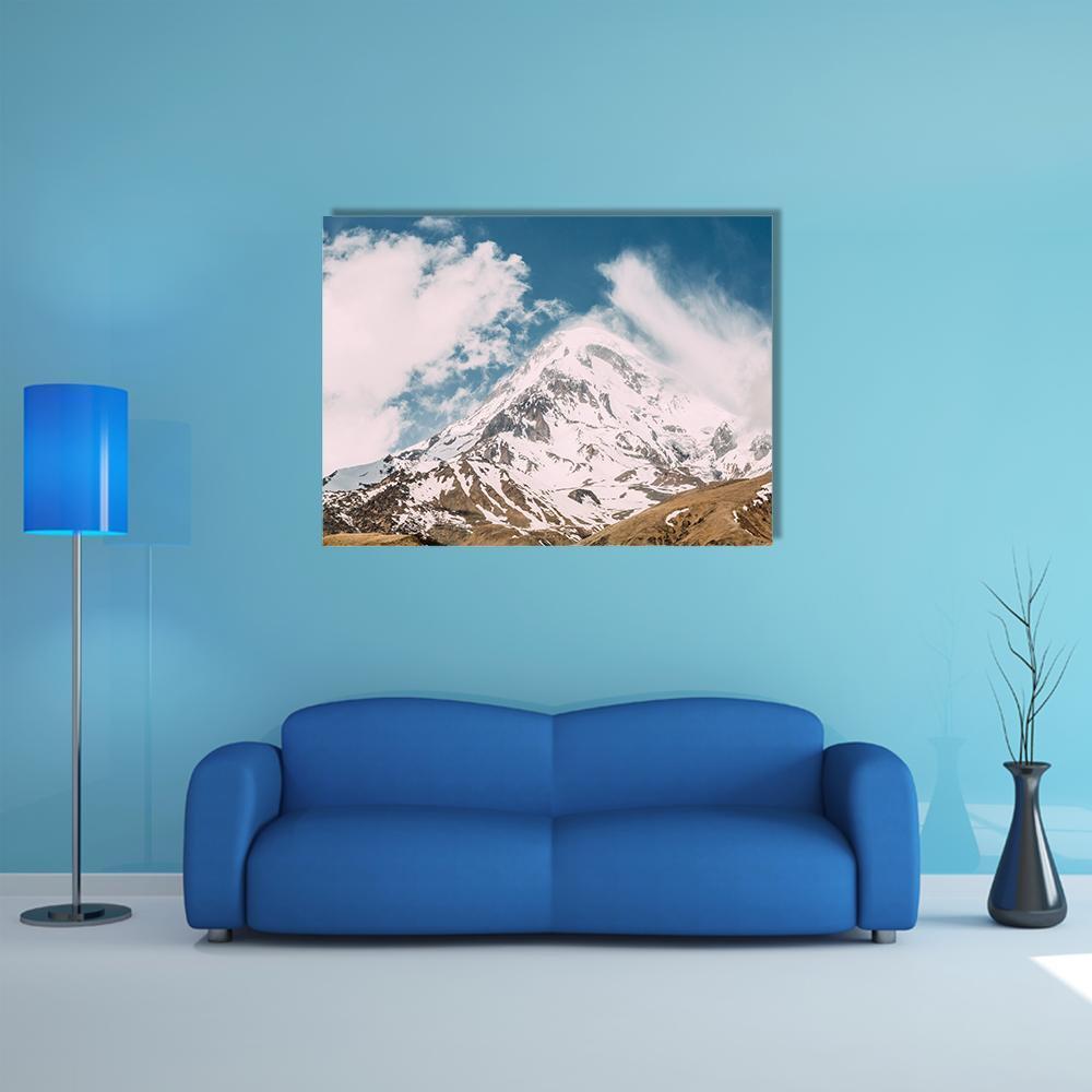 Peak of Mount Kazbek Canvas Wall Art in white, brown and blue, single panel hung on a wall