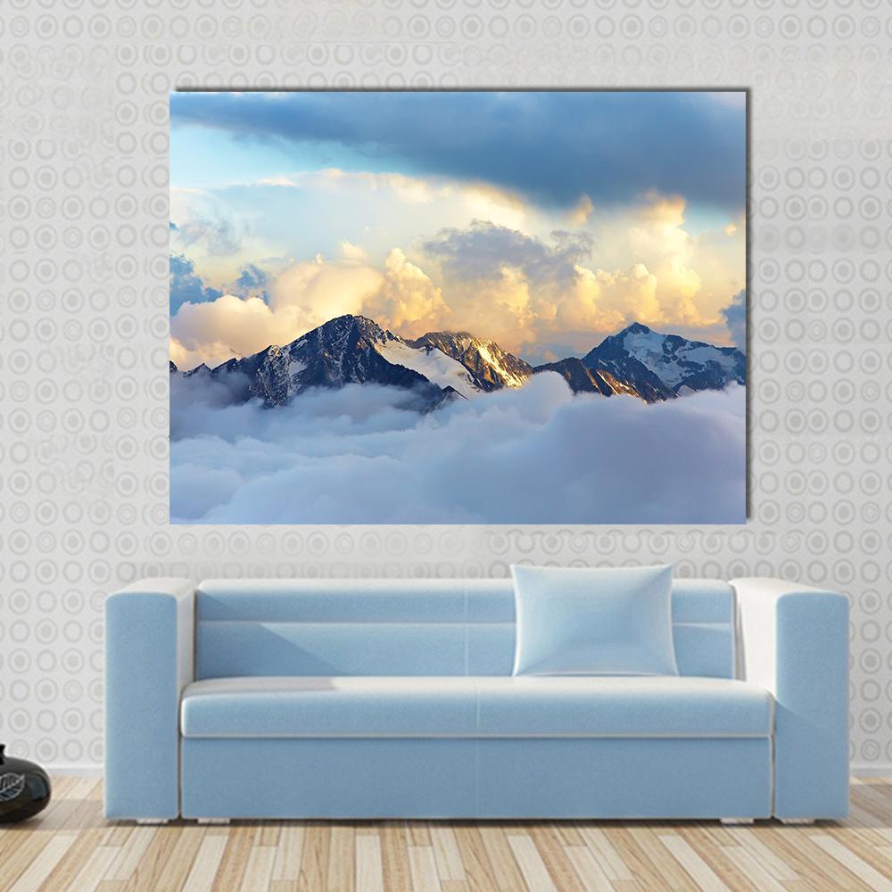 Snow-capped Mountain Peaks and Clouds Canvas Wall Art in white, gray and blue, single panel hung on a wall
