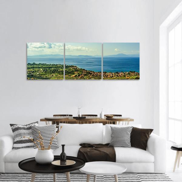Pelio Pagasitikos Gulf Village View Panoramic Canvas Wall Art in white, green and blue, hung on a wall
