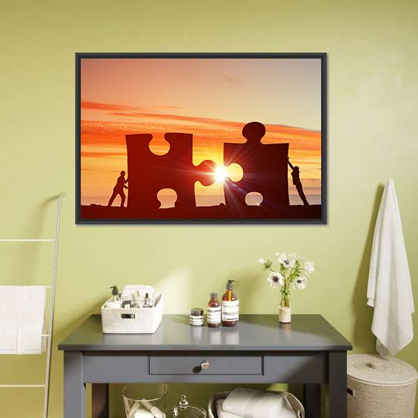 People Connecting Puzzle Pieces Canvas Wall Art in black, orange and yellow, framed canvas, product view on a white background