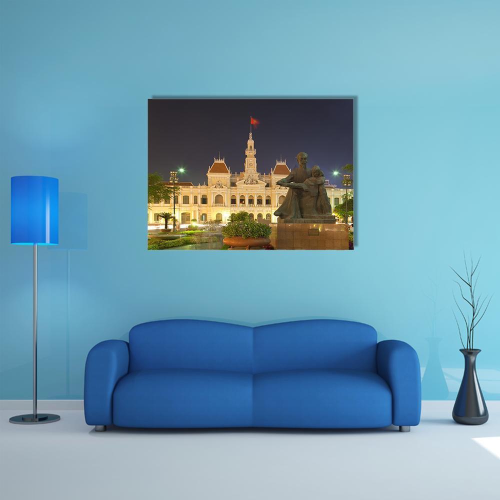 People's Committee Building at Night Canvas Wall Art in black, brown and yellow, single panel hung on a wall