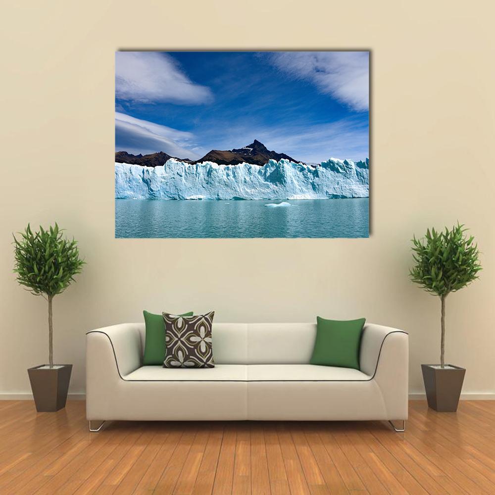 Perito Moreno Glacier and Andes Mountains Canvas Wall Art in white and blue, single panel hung on a wall