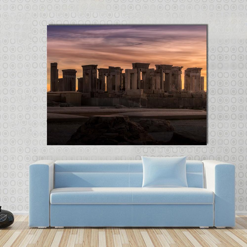 Persepolis Under Dramatic Clouds Canvas Wall Art in brown, orange and purple, single panel hung on a wall
