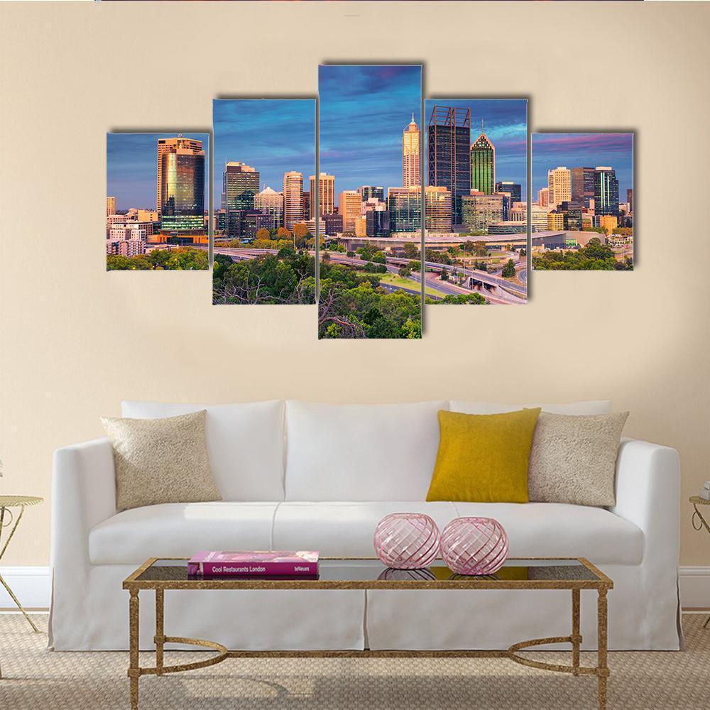 City Skyline at Sunset Canvas Wall Art in orange, yellow and blue, 5 panel Star layout hung on a wall