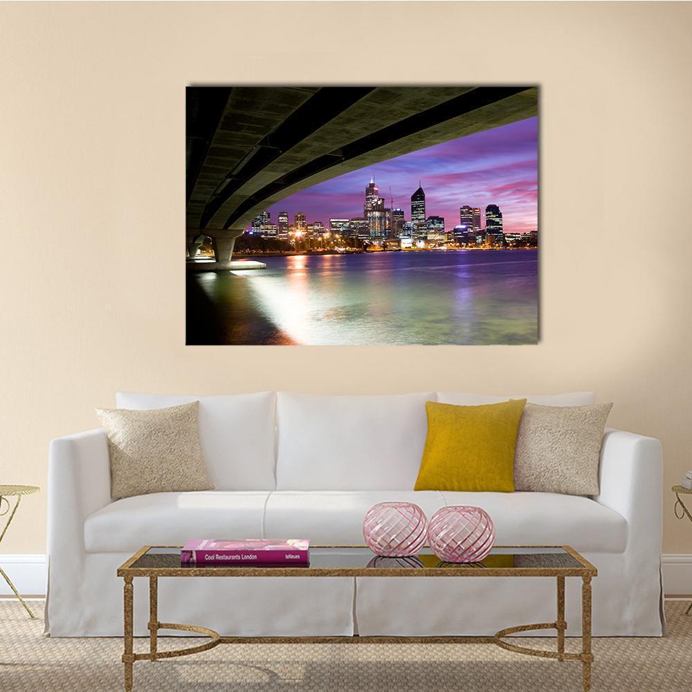 City Skyline with Bridge at Dusk Canvas Wall Art in black, blue and purple, single panel hung on a wall
