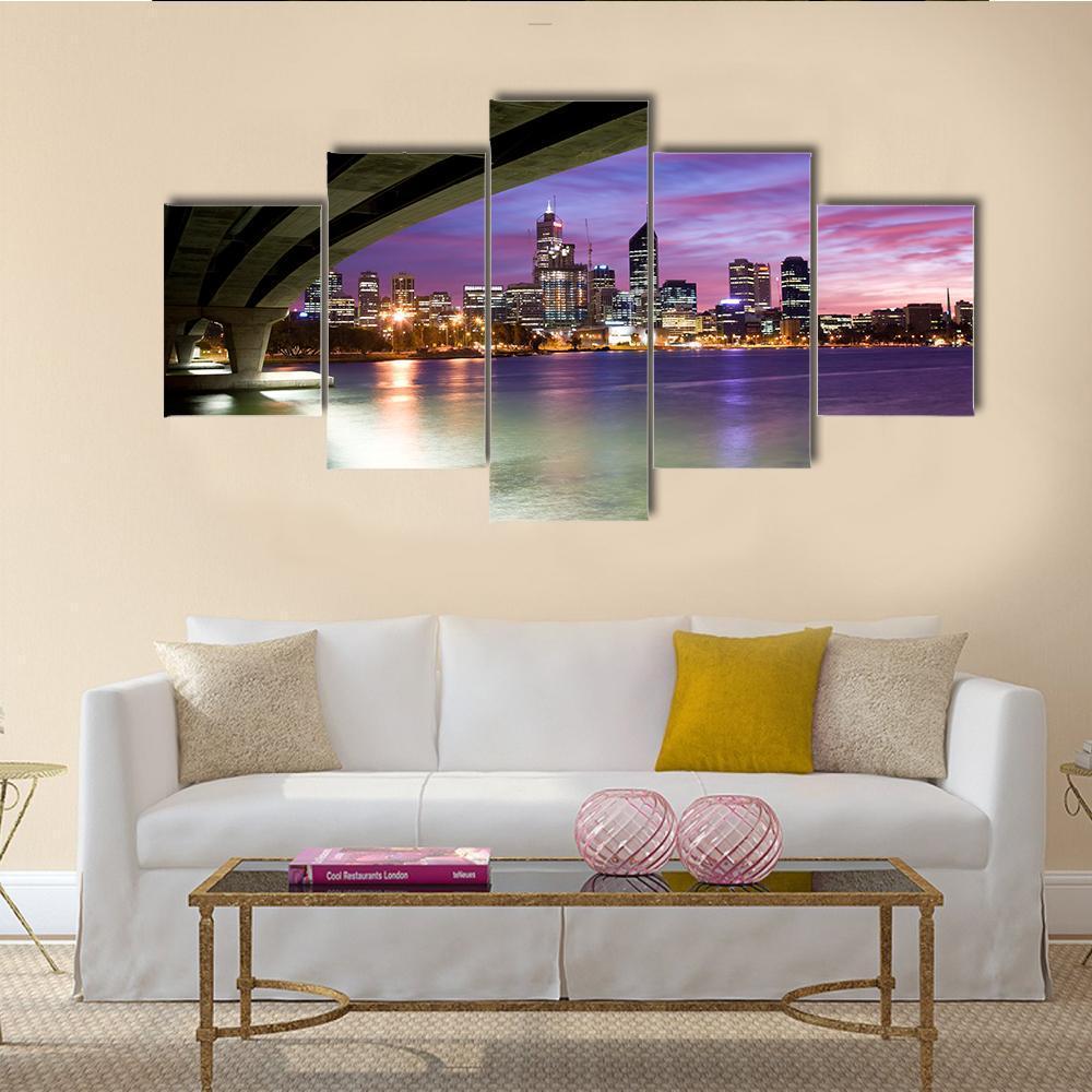 City Skyline with Bridge at Dusk Canvas Wall Art in black, blue and purple, 5 panel Star layout hung on a wall