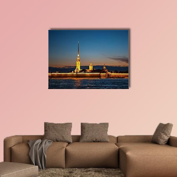 Peter and Paul Fortress on Hare Island at Night Canvas Wall Art in black, yellow and blue, single panel hung on a wall