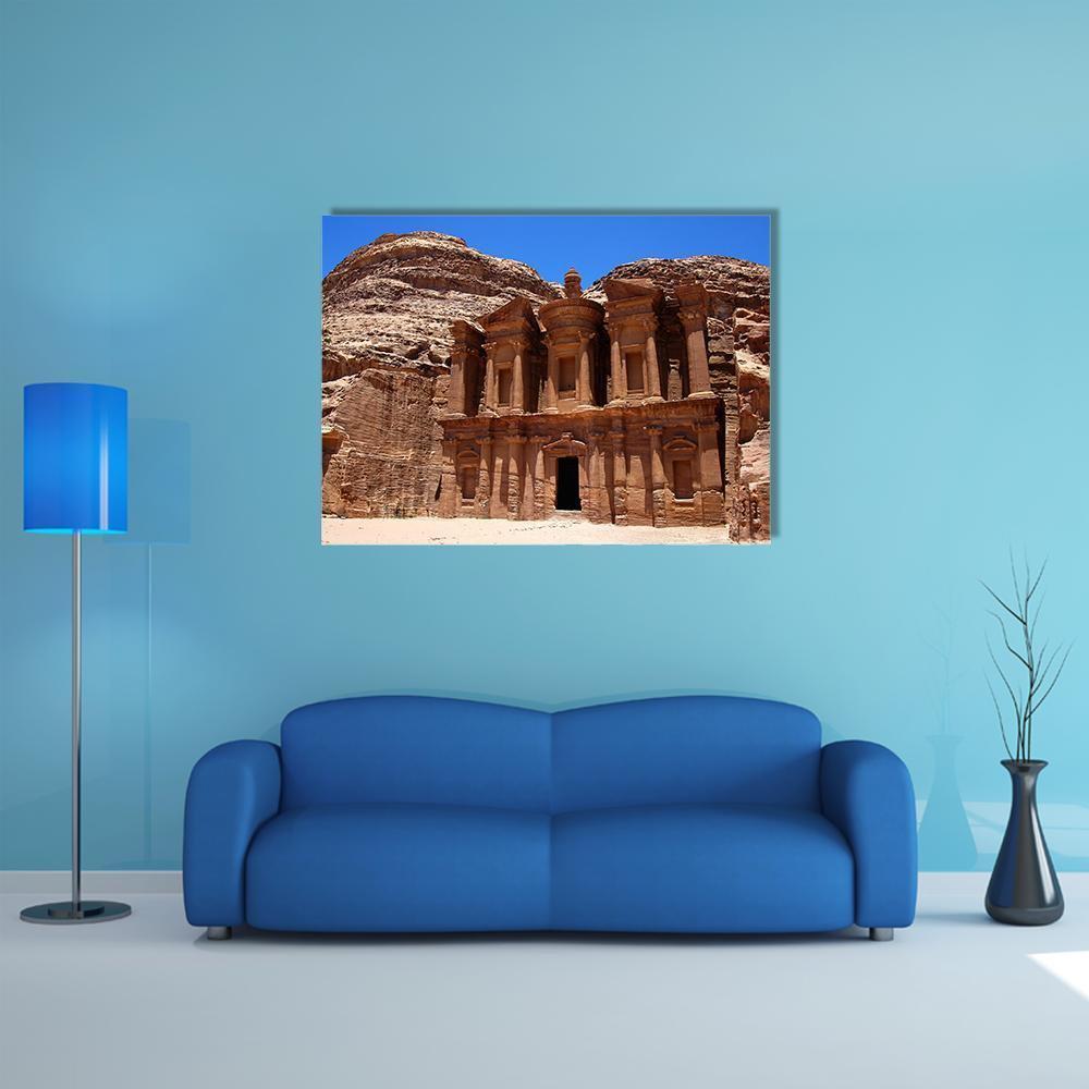 Petra Treasury Facade in Jordan Canvas Wall Art in beige, brown and blue, single panel hung on a wall