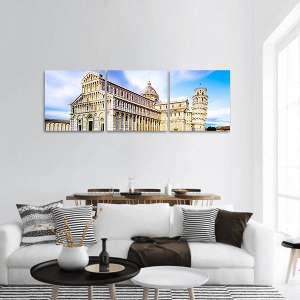 Pisa Cathedral and Leaning Tower Panoramic Canvas Wall Art in white, beige and blue, hung on a wall