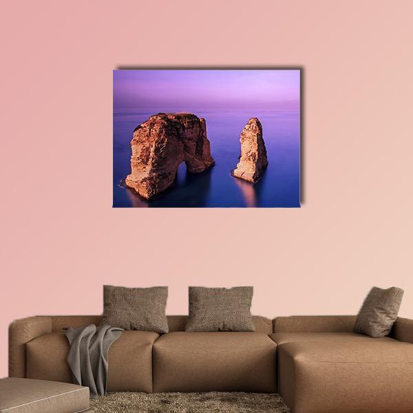 Rawsha Rock at Sunset Canvas Wall Art in brown, blue and purple, single panel hung on a wall