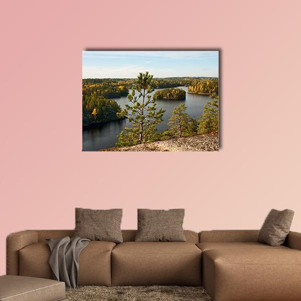 Autumn Pine Lake Landscape Canvas Wall Art in yellow, green and blue, single panel hung on a wall