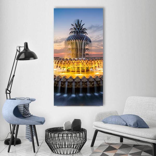 Pineapple Fountain with Illuminated Water Tiers Vertical Canvas Wall Art in gold, yellow and blue, single vertical panel hung on a wall