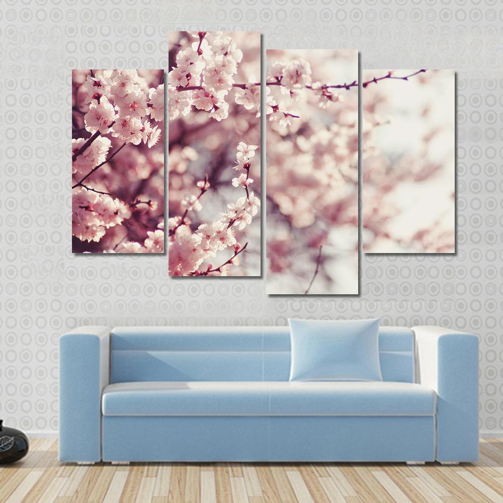 Pink Cherry Blossoms Flowers Canvas Wall Art in white and pink, 4 panel Pop layout hung on a wall