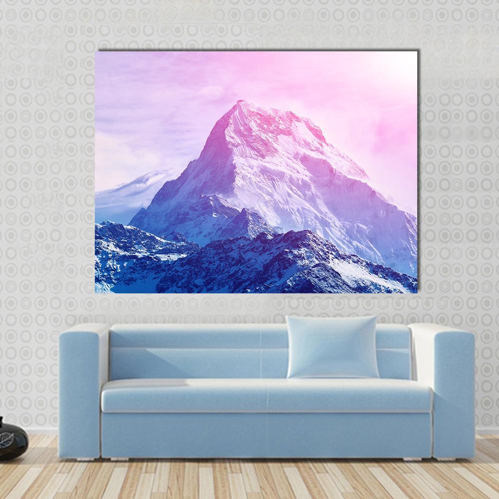 Pink Snowy Mountain Canvas Wall Art in white, blue and pink, single panel hung on a wall