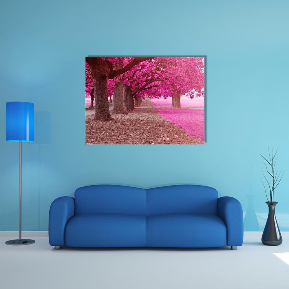 Park Path with Pink Trees Canvas Wall Art in brown and pink, single panel hung on a wall