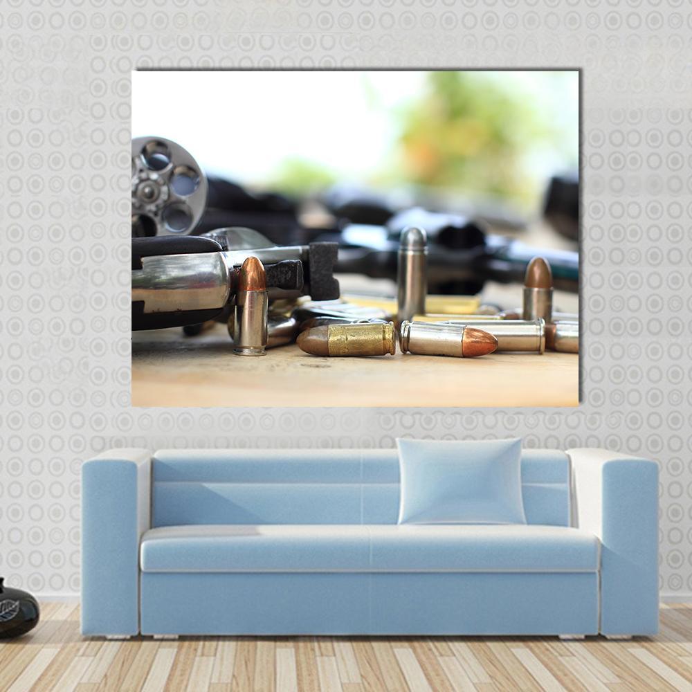 Pistol and Bullet on Table Canvas Wall Art in white and silver, single panel hung on a wall