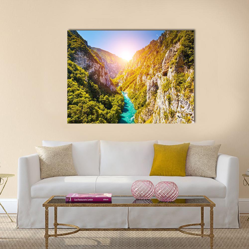 Piva Canyon in Montenegro Canvas Wall Art in yellow, green and blue, single panel hung on a wall