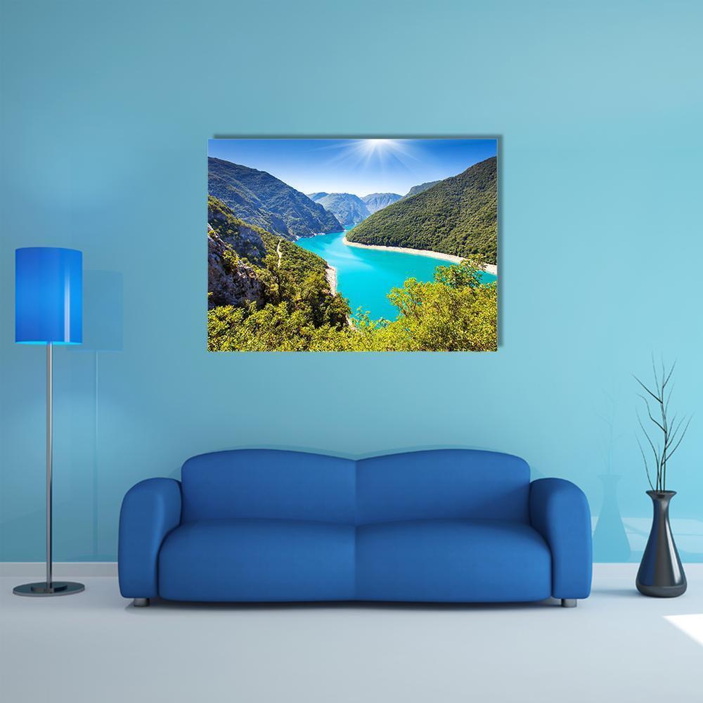 Piva Canyon and Its Reservoir Canvas Wall Art in green and blue, single panel hung on a wall