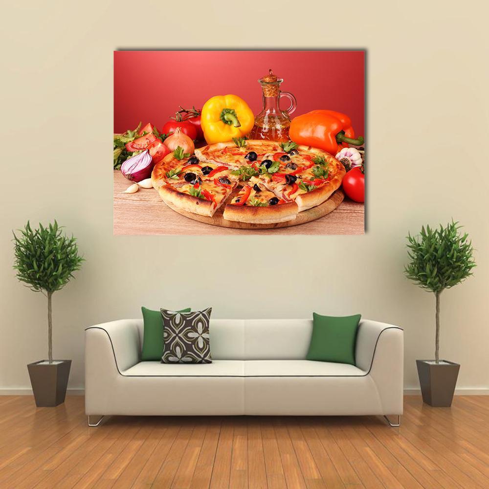 Pizza and Vegetables on a Table Canvas Wall Art in brown, red and yellow, single panel hung on a wall