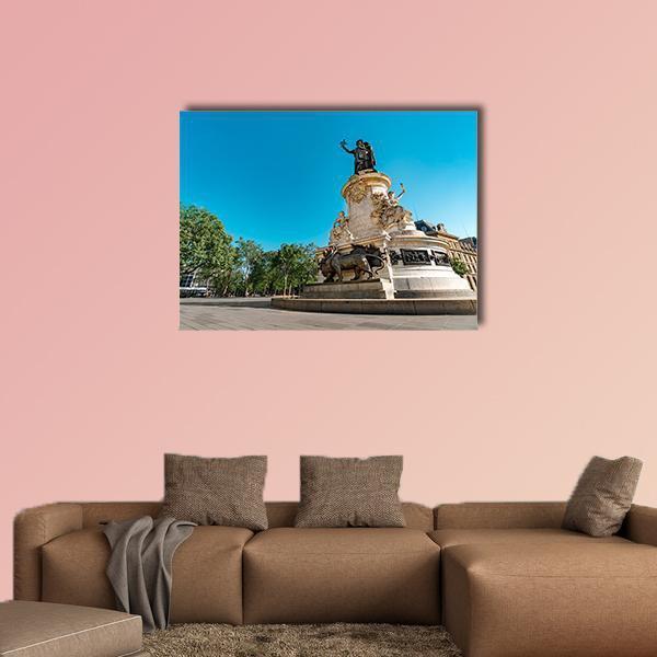 Place De La Republique Paris Statue with Bronze Lions Canvas Wall Art in beige and blue, single panel hung on a wall