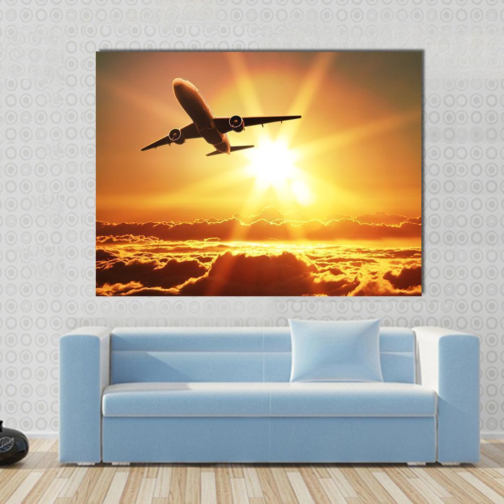 Plane Takes Off at Sunrise Canvas Wall Art in brown, orange and yellow, single panel hung on a wall
