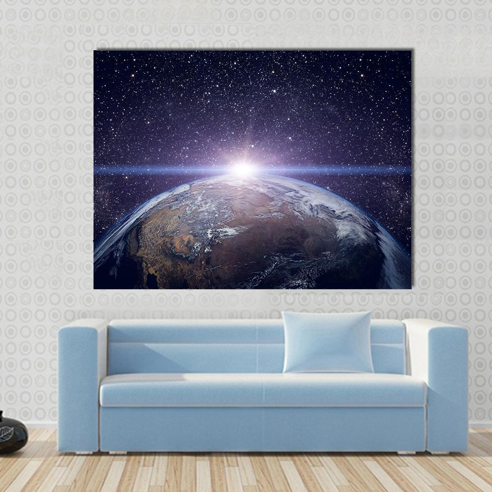 Planet Earth Sunset Canvas Wall Art in black, blue and purple, single panel hung on a wall