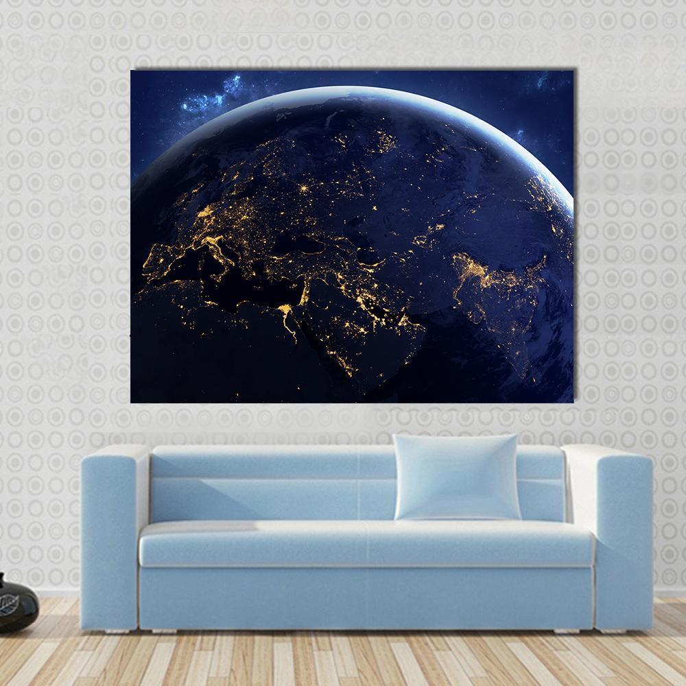 Planet Earth from Space at Night Canvas Wall Art in black, blue and navy, single panel hung on a wall