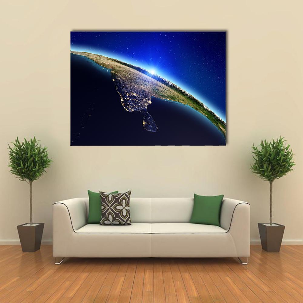 Earth Sunrise Over India Canvas Wall Art in black, gold and blue, single panel hung on a wall