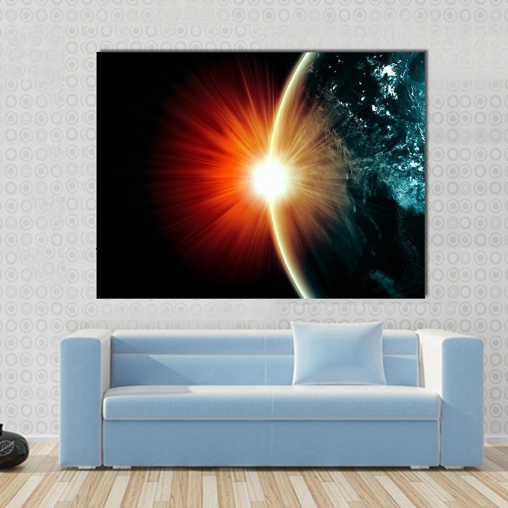 Planet Earth with Sunbeam Light Canvas Wall Art in black, orange and blue, single panel hung on a wall