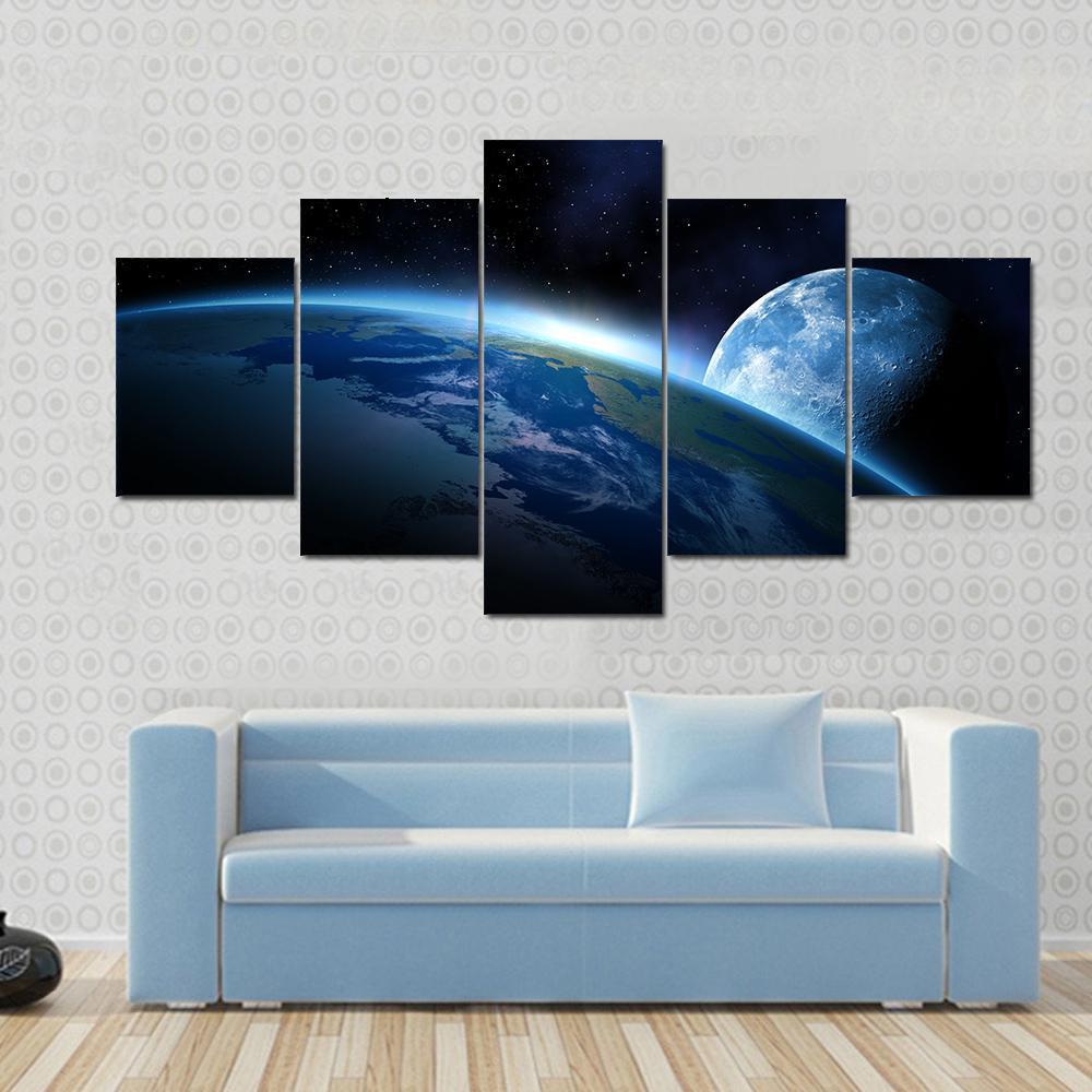 Earth and Moon at Sunrise Canvas Wall Art in black and blue, 5 panel Star layout hung on a wall