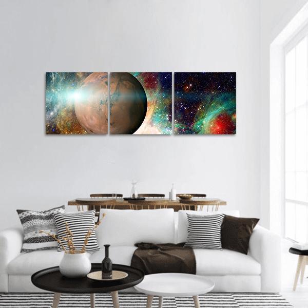 Mars-like Planet Over Nebula Panoramic Canvas Wall Art in black, orange and blue, hung on a wall