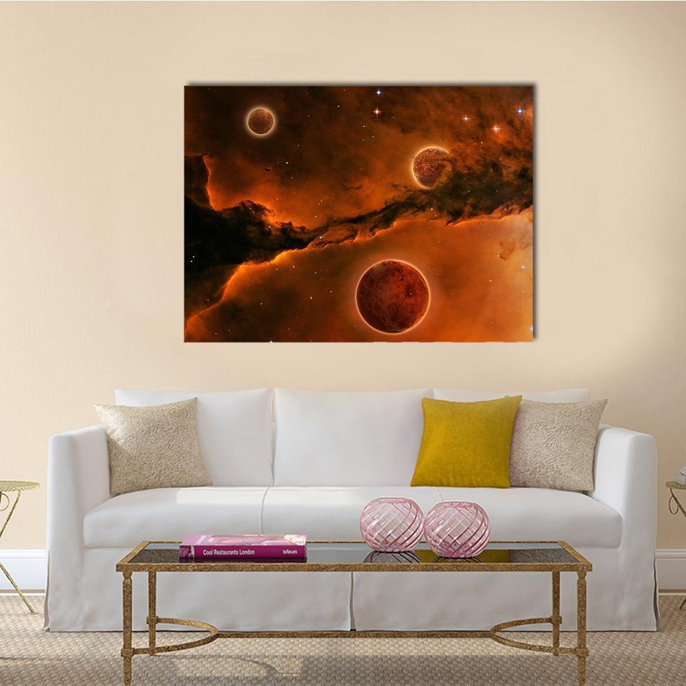 Three Planets Near a Nebula Canvas Wall Art in black, brown and orange, single panel hung on a wall