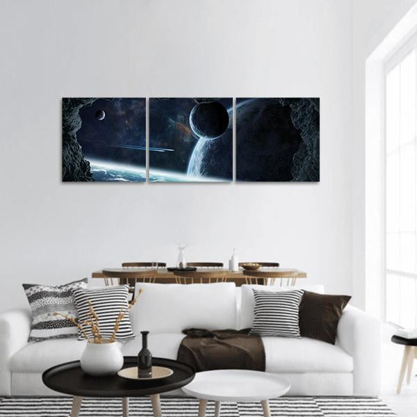 Planets Seen from a Cave Panoramic Canvas Wall Art in black and blue, hung on a wall