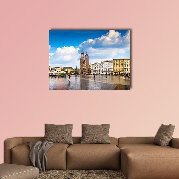Historic Polish City Square Canvas Wall Art in white, brown and blue, single panel hung on a wall