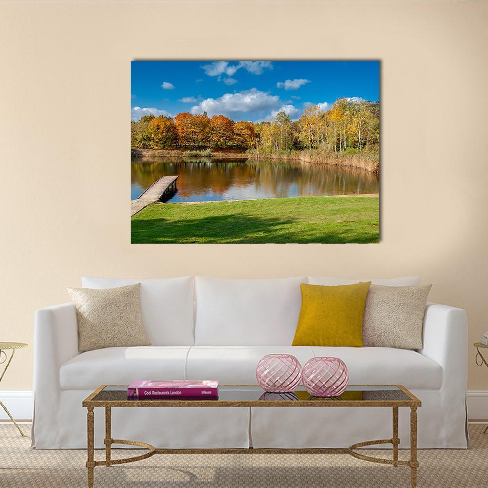 Pond at Szczesliwice Park, Warsaw Canvas Wall Art in orange, green and blue, single panel hung on a wall